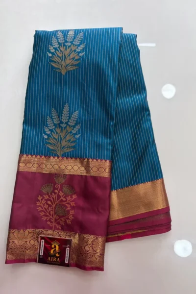 Teal Blue Semi Pattu Saree with gold stripes, floral motifs and magenta zari pallu