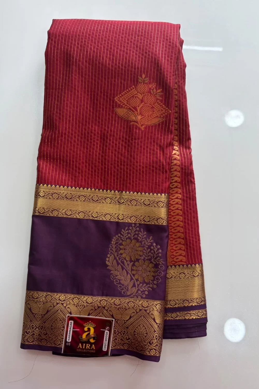 Wine Maroon Semi Pattu Saree with gold stripes and purple floral zari pallu